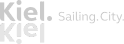 Logo der Kiel Sailing City mit stilisiertem Schriftzug in weiß auf transparentem Hintergrund.
